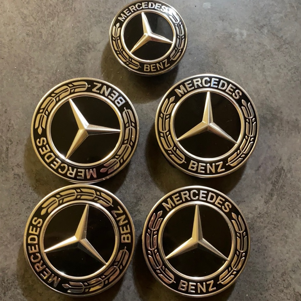 Mercedes Benz wheel hub covers and hood emblem.